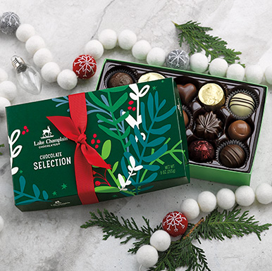 Assorted gourmet chooclates in a green holiday themed gift box