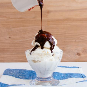 jars of chocolate fudge sauce and salted caramel sauce