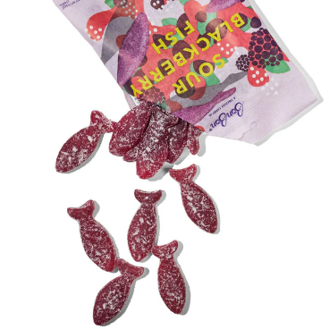 Sour blackberry gummy fish coming out of the corner of the packaging.