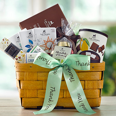 Gift basket filled with assorted gourmet chocolates with a green thank you ribbon