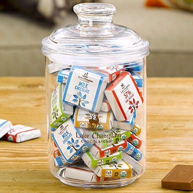 Assorted chocolate squares in an acrylic candy jar with LCC logo