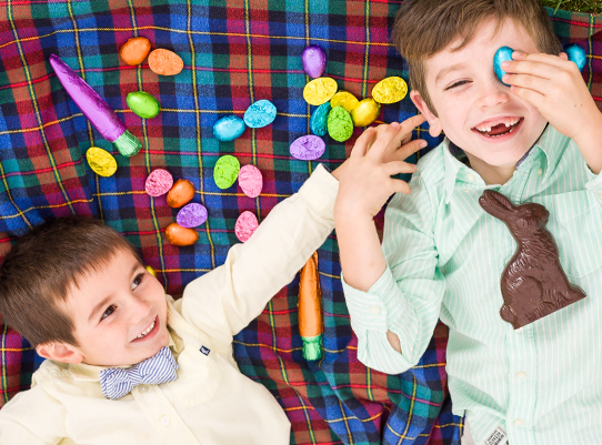 two little boys playing with Easter chocolates