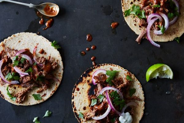 braised pork tacos in a chocolate cherry ancho mole