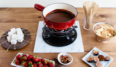 pot of chocolate fondue with dippers