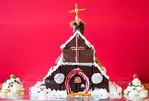 a finished gingerbread house made out of chocolate bars