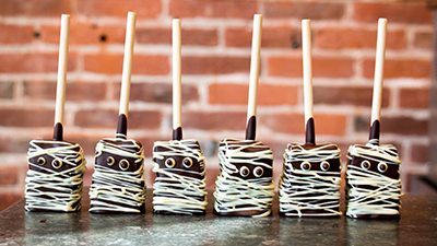 a line of mummy marshmallow pops