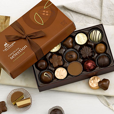 Assorted gourmet chocolates in a brown gift box