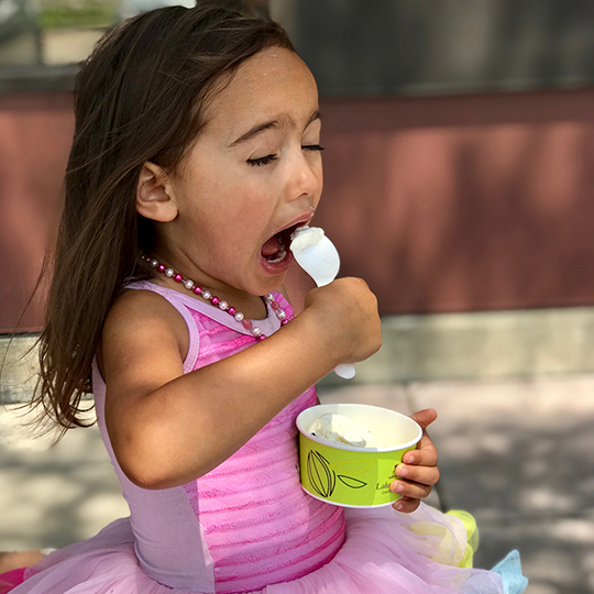 little girl enjoying an ice cream