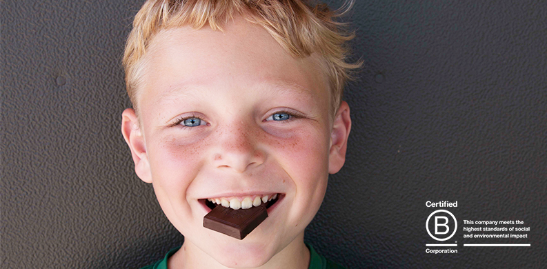 Olin eating a square of organic chocolate