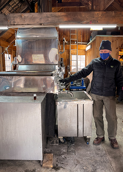 David Allen showing off his maple syrup evaporator