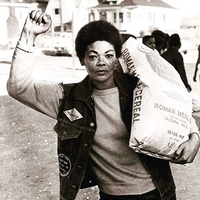 woman holding a bag of corn meal