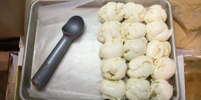 scoops of vanilla ice cream on a tray