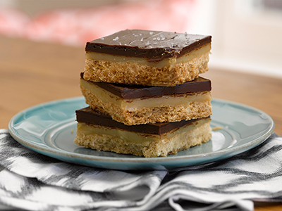 stack of salted caramel millionaire bars on a plate