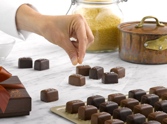 sprinkling sea salt on caramels