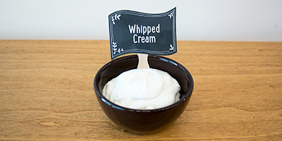 bowl of homemade whipped cream for ice cream sundae bar