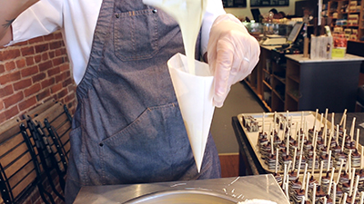 filling a piping bag with white chocolate