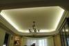 Warm ambient LED strip cove lighting installed in recessed ceiling bulkhead