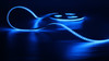 RGB LED strip glowing blue on reel – SMD 3838 120 LEDs per metre 24V IP67 waterproof