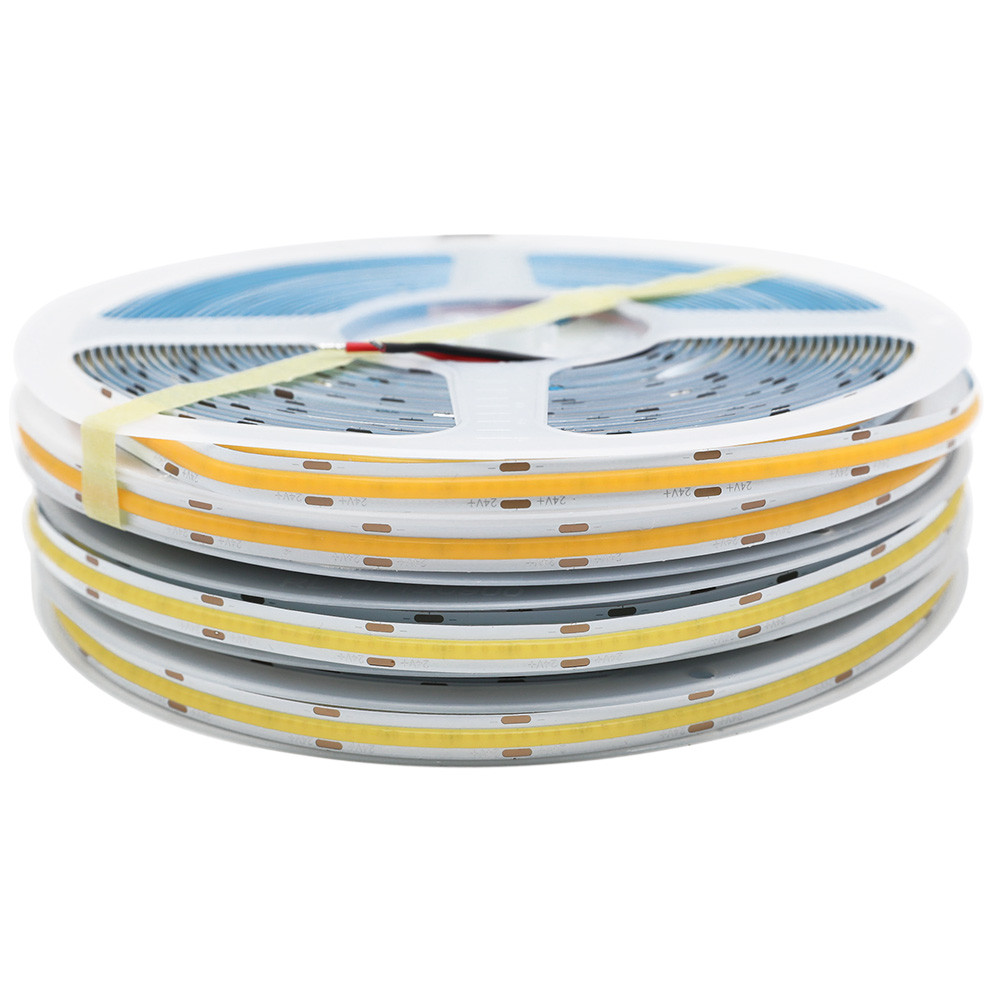 Macro close-up of a COB LED strip showing the continuous phosphor silicone coating that eliminates visible dots