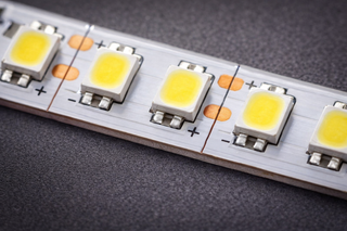 Macro close-up of an SMD 2835 LED strip showing individual surface-mounted diodes spaced across the PCB