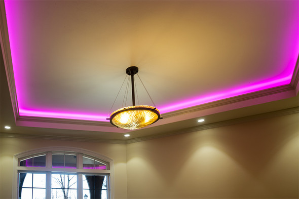 RGB LED strip ceiling cove lighting with purple ambient glow in modern interior design