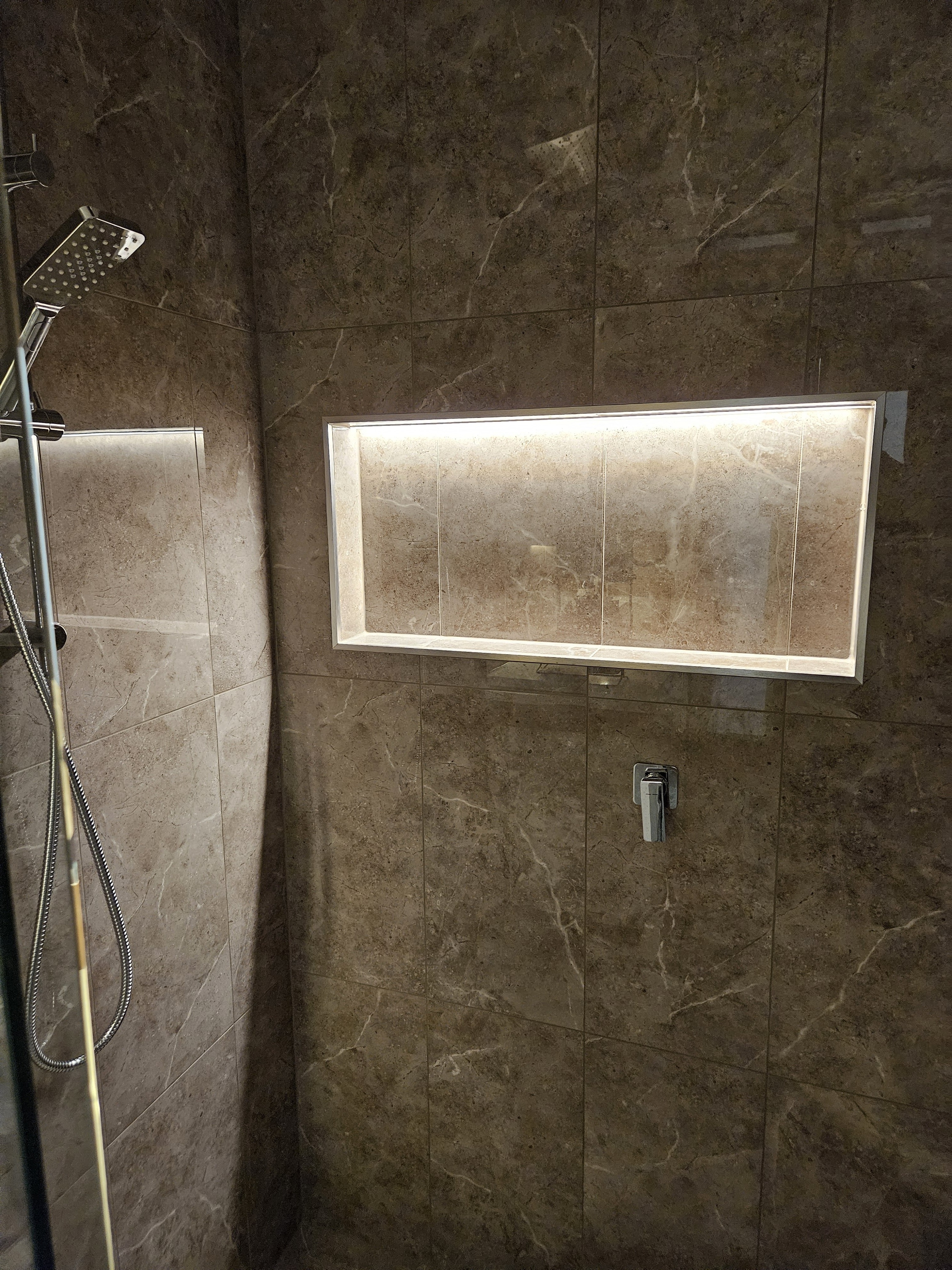 Full width shower shelf lighting