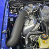 <p>JLT Next Generation Cold Air Intake Kit for 2003,2004 Cobra available in black textured plastic. This replaced our original Cold Air kit in January 2012.</p>
<p><strong>Intake Tube</strong><br />Using the original JLT CAI as a guide, we molded, sculpted and perfected everything until we had the best looking, fitting and performing system you can buy. The JLT tube is 4 1/4 inch ID, roto molded plastic to resist engine heat and keep the Intake air charge nice and cool. No Metal Tubing Here!!</p>
<p>MAF and filter relocated into fender well for a cooler Intake charge and can support up to 550 RWHP.</p>
<p><strong>Molded In MAF</strong><br />The best part of this new JLT Cold Air is we kicked the cool factor up a notch and molded a 105mm MAF housing right in the tube. Now you have a kit you can grow into and not have to buy a Complete new kit when you reach over 550 RWHP.</p>
<p>Putting a Whipple or Kenne Bell blower on your 03, 04 Cobra? Simply drill out the pre molded plug on the MAF block located on the bottom of the tube, discreetly out of sight. Install your SCT MAF 2600 or 3000 sensor electronics, add our huge 4.5 X 12 inch S and B Powerstack filter and you've now changed your JLT Cold Air Intake into a JLT High Boost 12 inch Intake.</p>
<p>Molding the MAF into the tube makes for a much smoother air flow with no couplers, reducers or separate MAF housing and can support 800 and up RWHP for only the cost of the 12 inch upgrade kit, 60.00. Will not work with stock MAF, SCT 2400 or 2800 MAF.</p>
<p><strong>Gains</strong><br />26-30 RWHP are typical with this kit.</p>
<p><strong>Easy Install</strong><br />The new Design, detailed instructions and online video instructions helps make this an easy install.</p>
<p><strong>Kit Includes:</strong></p>
<ul>
<li>JLT Plastic Intake Tube</li>
<li>Silicone Coupler</li>
<li>Silicone Reducer</li>
<li>Apron Plate</li>
<li>4x6 S and B Powerstack Air Filter</li>
<li>MAF Adapter</li>
<li>MAF Adapter Gasket</li>
<li>HD Clamps and all needed hardware</li>
</ul>
<p><strong>Note: </strong></p>
<ul>
<li>Uses stock Mass Air Meter</li>
<li>Will not fit with most strut tower braces or aftermarket K-Members.</li>
<li>This kit is street legal in all US states.</li>
<li>CARB Exempt ID: D-761-2</li>
</ul>