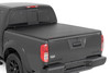 All-Weather Bed Protection: Rough Country's Soft Roll-Up Bed Cover delivers reliable protection against the elements while preserving full bed functionality. Constructed from high-quality, marine-grade vinyl with a sleek matte black finish, this durable cover features heavy-duty hook-and-loop side seals and tight front and rear barriers to shield your cargo from rain, dust, and debris.Streamlined Low-Profile Design: Sitting just 1-1/8" above the bed, this top-mount cover blends seamlessly with your truck's lines for a clean, stylish look. The corrosion-resistant, black powder-coated aluminum frame offers long-lasting strength without sacrificing style or aerodynamics.Fast and Easy Bed Access: The roll-up design and spring-latch closure system make opening and closing the cover a breeze. A single cable pull lets you release the latch quickly, giving you fast access to your full bed whenever you need it. Whether you're hauling gear or unloading tools, convenience comes standard.Effortless Installation: No drilling required - this cover installs in just 20 minutes using the included bracket system and tools. It mounts securely to your factory bed rails for a snug, hassle-free fit you can count on.Protected by a 5-Year Warranty: Rough Country backs this Soft Roll-Up Bed Cover with a 5-Year Replacement Warranty, protecting against structural and workmanship defects so you can hit the road with total confidence.