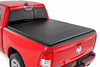 All-Weather Bed Protection: Rough Country's Soft Roll-Up Bed Cover delivers reliable protection against the elements while preserving full bed functionality. Constructed from high-quality, marine-grade vinyl with a sleek matte black finish, this durable cover features heavy-duty hook-and-loop side seals and tight front and rear barriers to shield your cargo from rain, dust, and debris.Streamlined Low-Profile Design: Sitting just 1-1/8" above the bed, this top-mount cover blends seamlessly with your truck's lines for a clean, stylish look. The corrosion-resistant, black powder-coated aluminum frame offers long-lasting strength without sacrificing style or aerodynamics.Fast and Easy Bed Access: The roll-up design and spring-latch closure system make opening and closing the cover a breeze. A single cable pull lets you release the latch quickly, giving you fast access to your full bed whenever you need it. Whether you're hauling gear or unloading tools, convenience comes standard.Effortless Installation: No drilling required - this cover installs in just 20 minutes using the included bracket system and tools. It mounts securely to your factory bed rails for a snug, hassle-free fit you can count on.Protected by a 5-Year Warranty: Rough Country backs this Soft Roll-Up Bed Cover with a 5-Year Replacement Warranty, protecting against structural and workmanship defects so you can hit the road with total confidence.