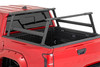 Upgrade your Tacoma Bed. The Tacoma Bed Rack from Rough Country gives you the flexibility to carry bulky cargo and outdoor equipment in your truck bed. It's just right for loading ladders, roof racks, bikes, and more with ease. And whether you're headed out for a camping trip or working under the sun on a job site, this bed rack keeps all your equipment close at hand.\
Durable Style: This innovative bed rack system is built from durable powder-coated aluminum for lightweight strength and durability. The modular design allows you to add as many crossbars as needed, and the molded end caps and T-slot covers give your truck that clean look you're looking for. Rugged enough to handle any payload you can throw at it; our bed rack is sure to turn headsΓÇöand help you carry your gear wherever you need it.\
Installation and Warranty: This easy-to-install rack offers endless mounting options and adjustability, so you can customize it to suit your specific needs. It also retains rear visibility, making it the perfect choice for those who want to maintain a clear view while driving. Plus, it comes with Rough Country's Limited Lifetime Warranty, so you can rest assured that it's built to last. So, load up and hit the road with confidence, knowing that Rough Country has you covered.