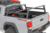 Upgrade your Tacoma Bed. The Tacoma Bed Rack from Rough Country gives you the flexibility to carry bulky cargo and outdoor equipment in your truck bed. It's just right for loading ladders, roof racks, bikes, and more with ease. And whether you're headed out for a camping trip or working under the sun on a job site, this bed rack keeps all your equipment close at hand.\
Durable Style: This innovative bed rack system is built from durable powder-coated aluminum for lightweight strength and durability. The modular design allows you to add as many crossbars as needed, and the molded end caps and T-slot covers give your truck that clean look you're looking for. Rugged enough to handle any payload you can throw at it; our bed rack is sure to turn headsΓÇöand help you carry your gear wherever you need it.\
Installation and Warranty: This easy-to-install rack offers endless mounting options and adjustability, so you can customize it to suit your specific needs. It also retains rear visibility, making it the perfect choice for those who want to maintain a clear view while driving. Plus, it comes with Rough Country's Limited Lifetime Warranty, so you can rest assured that it's built to last. So, load up and hit the road with confidence, knowing that Rough Country has you covered.