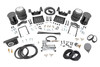 Ideal Leveling: Is your truck your workhorse? The main attraction of a pickup is the ability to haul and tow as needed. However, due to the weight in the bed or the condition of the rear leaf springs, your vehicle may become un-level under load. At Rough Country, we've designed a solution to eliminate these concerns. Introducing Rough Country's Rear Air Spring Kit.Heavy-Duty Construction: Rough Country's Rear Air Spring Kit includes two high-quality, double convoluted air bags, reinforced with durable powder-coated steel brackets and DOT-approved airlines. Whether you're towing a trailer or hauling heavy loads, this kit helps ensure your vehicle remains level, alleviating the strain on your trailer's tongue weight. The kit features 1/4" push-to-connect air fittings for easy installation, along with all necessary bracketry for a secure fit. Rough Country's Air Spring Kit supports up to 5,000 lbs of load, minimizing sway and preventing bottoming out while braking and steering.Easy Installation: Quick and simple setup for immediate use. Rough Country's kit can be installed at home with standard tools in just 5-6 hours, ensuring minimal downtime and fast, hassle-free installation.Onboard Air Compressor and Wireless Controller: For added convenience, Rough Country offers an optional onboard air compressor and wireless controller to easily adjust your air spring kit on the go. Control air pressure at the push of a button from the comfort of your vehicle.Reliable Warranty Coverage: Rough Country's Rear Air Spring Kit includes a limited lifetime warranty on the air springs and a two-year replacement warranty on the compressor, offering lasting protection against manufacturer defects. This industry-leading coverage ensures confidence in both quality and durability, so you can count on Rough Country to keep your truck performing at its best.