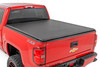 All-Weather Bed Protection: Rough Country's Soft Roll-Up Bed Cover delivers reliable protection against the elements while preserving full bed functionality. Constructed from high-quality, marine-grade vinyl with a sleek matte black finish, this durable cover features heavy-duty hook-and-loop side seals and tight front and rear barriers to shield your cargo from rain, dust, and debris.Streamlined Low-Profile Design: Sitting just 1-1/8" above the bed, this top-mount cover blends seamlessly with your truck's lines for a clean, stylish look. The corrosion-resistant, black powder-coated aluminum frame offers long-lasting strength without sacrificing style or aerodynamics.Fast and Easy Bed Access: The roll-up design and spring-latch closure system make opening and closing the cover a breeze. A single cable pull lets you release the latch quickly, giving you fast access to your full bed whenever you need it. Whether you're hauling gear or unloading tools, convenience comes standard.Effortless Installation: No drilling required - this cover installs in just 20 minutes using the included bracket system and tools. It mounts securely to your factory bed rails for a snug, hassle-free fit you can count on.Protected by a 5-Year Warranty: Rough Country backs this Soft Roll-Up Bed Cover with a 5-Year Replacement Warranty, protecting against structural and workmanship defects so you can hit the road with total confidence.