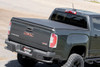 Want to streamline your ride and protect your gear from the elements? Look no further than Rough Country's Tri-Fold Vinyl Tonneau Cover! With its durable construction and easy installation, it's the perfect addition to any truck.\
Tri-fold Design for Style and Efficiency: This tonneau cover folds up in three sections for easy access to your bed whenever you need it. Need to haul a large item? Simply fold back a panel. When everything's loaded up, unfold it completely for a sleek look that can also improve your gas mileage.\
Security & Weatherproof Seal: Sitting firmly on the bed railing and featuring a heavy-duty vinyl construction with an all-weather seal, our tri-fold cover keeps your gear safe from prying eyes and the elements.\
Durable Construction: Crafted with a lightweight 6061 aluminum frame, this cover is tough enough to handle whatever rough terrain you throw at it while keeping your gear safe and sound.\
Effortless Installation: Our cover comes completely assembled in the box, no loose parts, no tools required. Thanks to our patented quick clamp system, you'll be ready to hit the road in no time.\
Protect your gear and streamline your ride with Rough Country's Tri-Fold Vinyl Tonneau Cover!