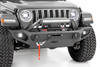 Transform the look and capabilities of your Jeep with Rough CountryΓÇÖs Full Width Trail Bumper. This full-width version of our fan-favorite Stubby Trail Bumper includes a few extra features youΓÇÖre sure to enjoy!\
Rough CountryΓÇÖs Jeep LED Trail Bumper has been engineered with a full-width design that fits in nicely with the factory flare or aftermarket modifications. With Jeep adding turn signals to the factory flares on JL and JT models, a full-width bumper can help lend an aggressive off-road look to your Jeep even when retaining the factory flare.\
Each kit includes a modular integrated fog light mount that allows you to run the included Rough Country 2-inch flush-mount led cubes. This front bumper also features a built-in Rough Country 20in Single-Row Black-Series LED Light Bar, providing 7,200 lumens and 100 watts of forward-facing illumination to help you easily see the trail ahead.\
Rough CountryΓÇÖs Full-Width Trail Bumper also features a set of D-ring shackles for a convenient recovery point, as well as a winch plate allowing you to install any standard-sized winch. A protective skid plate ensures unbeatable protection in off-road environments. If youΓÇÖre looking for one of the best Jeep bumpers available, look no further!