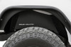 Clean up the look of your inner fenders when using aftermarket flares with Rough CountryΓÇÖs JK Rear Inner Fender Liners. This eye-catching inner fender upgrade helps protect sensitive areas from dust, mud, and debris, and can be easily installed in no-time flat!Aftermarket fenders are a huge improvement for most Jeeps wanting to get the best clearance and articulation possible, but when removing the stock fenders many people also remove the stock fender liners. With a unique 3-piece construction, these liners cover more areas than other liners on the market, giving more protection to your body panels. Each Rough Country liner features a corrosion-resistant powder coat for long-lasting durability. Additionally, these liners mount firmly to the body for quiet operation, free of rattling or vibration noise.The solid-steel, angular design with ΓÇ£Rough CountryΓÇ¥ logo cutouts gives an aggressive look to this now more visible area on your JK. The rear liner lines up perfectly to show the painted body color behind the cutout logo. Rough Country Inner Fender Liners feature a bolt-on installation process with minor drilling for an easy upgrade you can do with common tools in a home garage. Includes Rough CountryΓÇÖs Lifetime Replacement Warranty.