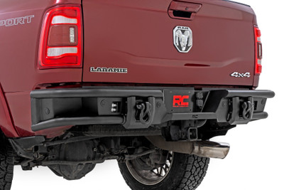 Rugged Rear-End Upgrade: Transform the rear of your Ram 2500/3500 with Rough Country's Tubular Rear LED Bumper. This aggressive, high-clearance design not only elevates your truck's off-road appearance but also improves departure angles for trail-ready performance. Whether you're crawling rocky terrain or cruising city streets, this bumper delivers head-turning style and rock-solid protection.Engineered for Strength and Function: Crafted from heavy-duty steel and finished in a corrosion-resistant, textured black powder coat, this bumper is built to handle whatever the road or trail throws your way. Its bold tubular design complements your Ram's body lines while providing dependable impact resistance and long-lasting durability.Fully Compatible and Sensor-Ready: This rear bumper is designed to retain your factory receiver hitch for full towing functionality and accommodates factory backup and proximity sensors. For Ram models not equipped with sensors, mesh block-off plates are included to maintain a clean, finished look.Light-Ready Design: Need extra visibility? This bumper includes provisions to mount Rough Country's 2-inch LED light cubes, giving you the ability to add powerful rear-facing illumination for trail spotting, worksite visibility, or night-time reversing.Hassle-Free Installation: No cutting, welding, or drilling required. This bumper features a 100% bolt-on installation using standard tools and can be completed in just 3-4 hours from the comfort of your garage.Backed by a Limited Lifetime Warranty: Rough Country backs this rear bumper with a limited lifetime replacement warranty against structural and workmanship defects, giving you confidence on every adventure.