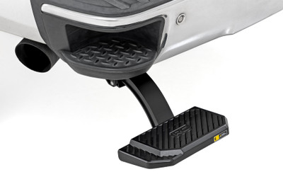 Climbing into your truck bed shouldn't feel like a workout. The Rough Country Manual Bed Step delivers instant access with a simple foot tap - dropping down 5 inches to give you the extra boost you need. Whether you're loading up tools, gear, or groceries, this step makes it easier on your back and knees, while keeping your footing secure in any condition.Effortless 5-Inch Drop: Skip the awkward reach and risky hops. This step provides a convenient 5-inch drop for smoother, safer access to your truck bed - anytime you need it.Hands-Free Deployment: Just a light push of the foot and you're good to go. The spring-loaded step deploys instantly and supports up to 330 lbs for heavy-duty performance without the hassle.Stable, Slip-Resistant Surface: The 6-inch wide die-cast aluminum board features a textured, non-slip finish that keeps you steady - even in rain, mud, or snow.Lightweight Strength That Lasts: Built from rugged die-cast aluminum, this step offers the perfect balance of durability and lightweight design - ready to handle the demands of daily use and off-road adventures alike.Simple Bolt-On Installation: No drilling. No stress. This step installs with basic hand tools, so you can hit the road with confidence in no time.Upgrade your truck with convenience and durability that works as hard as you do. The Rough Country Manual Bed Step is the perfect solution for easy, secure bed access - every time.