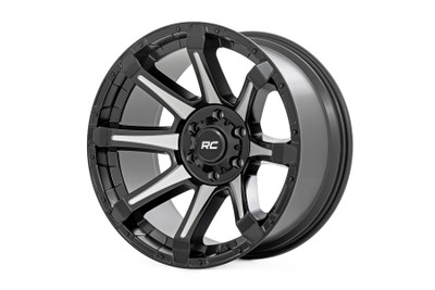 Upgrade your ride with the Rough Country 81 Series Wheel - a perfect fusion of performance and eye-catching design. Whether you're tackling tough trails or cruising the streets, this wheel delivers the bold, rugged look your vehicle deserves.Gloss Black with Machined Spokes: The precision-machined spokes contrast against the deep black finish, creating a bold, high-end look that demands attention.8-Spoke Design: Aggressive and dynamic styling, engineered for optimized strength and performance.Accent Bolts on the Outer Lip: Reinforce your vehicleΓÇÖs rugged appeal with aggressive detailing that stands out from every angle.Durable Aluminum Construction: Built from high-strength, single-piece aluminum, these wheels offer exceptional toughness without unnecessary weight, keeping performance at its peak.Sleek Black Center Cap: The included Rough Country black center cap ties the whole look together for a clean, aggressive finish.Warranty-Backed Confidence: Drive with peace of mind, knowing your wheels are covered by a 1-year finish warranty and a Limited Lifetime Structural Warranty for long-lasting durability.For the off-road enthusiast who refuses to compromise on strength or style, the Rough Country 81 Series Wheel is the ultimate upgrade. Dominate the trails. Own the streets. Stand out.