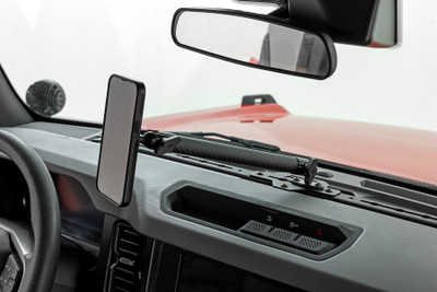 Rough CountryΓÇÖs Bronco Dash Mount puts an end to those awkward scrambles by keeping your phone right where it belongsΓÇösecure, visible, and easy to grab. Designed for easy access and a clean, organized dash, this mount makes it easy to keep your eyes on the road while your device stays put.Easy Access to Your Phone: No more digging around or struggling to find your phone. With this dash mount, your device is always within easy reach, whether youΓÇÖre navigating rough terrain or stuck in traffic.Clear the Clutter: Give your Bronco a clean, organized look by keeping your phone off the seats and out of the cup holders. This mount helps you stay tidy and keeps your essentials where they should be.Tough as Nails: Made from 14-gauge powder-coated steel, this mount is built to handle any off-road adventure or daily drive with ease. Durable, rugged, and ready for anything.100% Bolt-On Installation: Easy installation means you can get it done in minutes. Just bolt it on, and youΓÇÖre good to go. No drilling, no extra hardware, no worries.From back roads to city streets, the Rough Country Bronco Dash Mount keeps your device locked in place, leaving you free to focus on the drive.