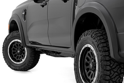 Style and Protection. Unlock the power of real protection and custom style with Rough Country's Sport Style Fender Flares for your Ford Ranger! Offering 5 inches of Flare Height, you know your truck is getting the coverage it needs from flying debris and road grime. Not only will these flares safeguard your vehicle, but they will look great too - featuring a bold custom look that stands out and turns heads. Plus, if you want to take your customization game up a notch, these fender flares are easily paintable so they can match your truck in color and style. Get ready to rock this new rugged look ΓÇô with Rough Country's Ranger Sport Style Fender Flares!Sturdy Construction. These bold and rugged fender flares are designed exclusively for fifth-generation Ford Ranger owners, creating an instant upgrade for your ride. Made from a special Tri-Blend ABS material, these flares have maximum strength and durability, ensuring they will stand up to the toughest conditions that nature has to offer. For added protection, each fender is machine-formed to exact specifications with a high-grade UV protection. Not only do these fender flares look great, but you can trust that they will hold up and continue looking fresh despite the elements.Installation and Warranty. Featuring an easy and quick installation process, these flares have been designed to provide your truck with the stylish look you've been searching for without any of the hassle. Plus, if you need to bring your truck back to its original specs, the flares can be removed in a flash! But that's not all ΓÇô each set comes equipped with a three-year limited warranty. Stop dreaming about that showroom-level look and make it happen with Rough Country's Ranger Sport Style Fender Flares.