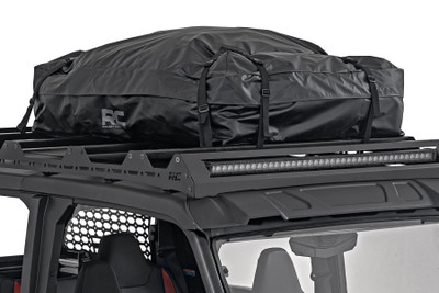 Finding room for all your gear can be a real challenge when itΓÇÖs time to hit the road for your next big adventure. Whether youΓÇÖre gearing up for a weekend in the wild or a cross-country escapade, Rough CountryΓÇÖs Roof Cargo Bag is the answer to your storage problems. You can load up all your essentials on top without cramming the inside of your ride, keeping things organized and ready for action. And with its rugged design, itΓÇÖs more than ready to take on any unexpected weather.Waterproof Fabric and Zipper: Rain, snow, or hailΓÇöbring it on. Our roof cargo bag is crafted with durable, waterproof fabric and a waterproof zipper, ensuring your gear stays bone dry no matter what the forecast says.UV Resistance:  With UV-resistant material, this bagΓÇÖs also designed to stand up to the sunΓÇÖs harshest punishment, keeping your gear shielded from harmful rays during those sun-soaked adventures.Anti-Slip Mat: The last thing you want is your cargo sliding around up there. ThatΓÇÖs why weΓÇÖve included an anti-slip mat to keep the bag securely in place, even when youΓÇÖre tackling those bumpy off-road trails.Includes Storage Bag: Done with your adventure? Easily pack away the roof cargo bag into its sleek storage bag. Keep things organized and clutter-free, so you're always prepared for your next ride.Rough Country's Roof Cargo Bag does more than store your gearΓÇöit locks it down tight, whether youΓÇÖre speeding along the highway or navigating rough terrain. And with all that space, you wonΓÇÖt have to think twice about packing those extra essentials.