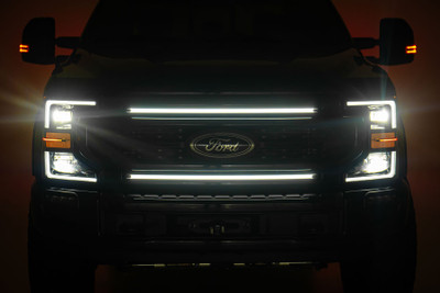 Tired of being caught in the dark? Our Grille Mount LED Light Kit is the answer to your nighttime needs. Designed specifically for the Ford F-250/F-350 Super Duty, this kit brings the brightness you need to tackle those moonless nights and foggy mornings with confidence.Blazing Brightness: This kit packs 324 LED chips that provide a powerful beam to light up even the darkest trails, ensuring you see every rock, rut, and mud puddle in your way.Durable Materials: Our lights, featuring a tough-as-nails aluminum housing and IP68 waterproof rating, are ready to withstand Mother Nature's wrath.Precision Lighting: The nylon reflector and silicone lens surface work together to deliver a focused, clear light. Say goodbye to scattered beams and hello to a sharp, consistent light that shows you exactly where youΓÇÖre headed.Long-Lasting Power: Running on 12V power and 32 watts, these lights are built to last over 50,000 hours. That's a whole lot of night drives, camping trips, and late-night work sessions.Complete Kit: No need to hunt down extra parts ΓÇô this kit includes everything you need: mounting brackets, hardware, and harness. Just mount it, wire it up, and hit the road.The Grille Mount LED Light Kit for your Ford F-250/F-350 Super Duty is the upgrade you didnΓÇÖt know you needed but wonΓÇÖt be able to live without. Whether youΓÇÖre navigating rugged terrain or setting up camp after dark, this kit has you covered. Light up the night with Rough CountryΓÇÖs Grille Mount LED Light Kit!