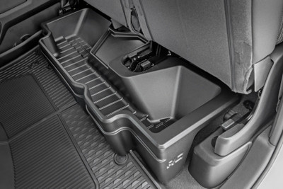 Clean up the contents of your cab with Rough CountryΓÇÖs Custom-Fit Under Seat Storage Compartment. These handy underseat truck storage compartments offer an easy way to store your gear with a custom, contoured look that blends in seamlessly with your vehicleΓÇÖs factory design. Keep your tools, gear, and other odds and ends organized and stowed away while conveniently stowed away under the rear seats.\
Each under-seat storage tray is constructed from a durable, high-density thermoplastic material thatΓÇÖs built to withstand kicks, nicks, and corrosion. A convenient anti-skid surface helps prevent the contents of your underseat cargo tray from rolling around while driving. Best of all, Rough CountryΓÇÖs Custom-Fit Under Seat Storage Compartments are easy to install, so you can upgrade your cargo management quickly and easily!