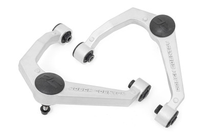 Durable One-Piece Design. Take your truck to the next level with Rough CountryΓÇÖs most durable Upper Control Arm to date! Rough CountryΓÇÖs Forged Upper Control Arms feature a solid, 1-piece design made of forged aluminum for superior strength and durability. This forged design outperforms all other types of arm construction, with no welding weak spots that could bend or break.\
High Strength Ball Joints. Rough CountryΓÇÖs Forged Upper Control Arms use POM ball joints which reduces metal-to-metal contact for less maintenance and longer service life versus standard or OE replacements. These Ball joints feature a POM ball race for an extremely low co-efficient of friction and an oversize ball diameter reduces load and improves range of motion in a fully greaseable design. Rough CountryΓÇÖs Forged Upper Control Arms also feature durable rubber bushings rubber bushings for superior quality and durability.\
Installation. Featuring a 100% bolt-on installation process, an estimated timeframe of 3-4 hours is recommended to complete this full installation. This full kit can be installed at home and can be completed efficiently and quickly!\
Limited Lifetime Replacement Warranty. Rough Country's Forged Aluminum Control Arms are backed with a limited lifetime replacement warranty towards manufacturer defects. As such, the product is protected from structural and workmanship damage after the date of purchase. With our industry-leading warranty give yourself peace of mind when using Rough Country's Suspension products!