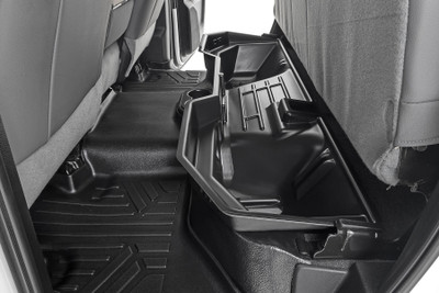 Clean up the contents of your cab with Rough CountryΓÇÖs Custom-Fit Under Seat Storage Compartment. These handy underseat truck storage compartments offer an easy way to store your gear with a custom, contoured look that blends in seamlessly with your vehicleΓÇÖs factory design. Keep your tools, gear, and other odds and ends organized and stowed away while conveniently stowed away under the rear seats.\
Each under-seat storage tray is constructed from a durable, high-density thermoplastic material thatΓÇÖs built to withstand kicks, nicks, and corrosion. A convenient anti-skid surface helps prevent the contents of your underseat cargo tray from rolling around while driving. Best of all, Rough CountryΓÇÖs Custom-Fit Under Seat Storage Compartments are easy to install, so you can upgrade your cargo management quickly and easily!