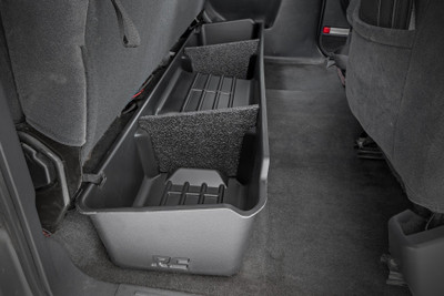 Clean up the contents of your cab with Rough CountryΓÇÖs Custom-Fit Under Seat Storage Compartment. These handy underseat truck storage compartments offer an easy way to store your gear with a custom, contoured look that blends in seamlessly with your vehicleΓÇÖs factory design. Keep your tools, gear, and other odds and ends organized and stowed away while conveniently stowed away under the rear seats.\
Each under-seat storage tray is constructed from a durable, high-density thermoplastic material thatΓÇÖs built to withstand kicks, nicks, and corrosion. A convenient anti-skid surface helps prevent the contents of your underseat cargo tray from rolling around while driving. Best of all, Rough CountryΓÇÖs Custom-Fit Under Seat Storage Compartments are easy to install, so you can upgrade your cargo management quickly and easily!