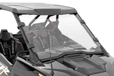 Added Protection and comfortability. Protect the occupants of your Polaris RZR from off-road hazards such as rocks, branches, and other debris with Rough Country's Scratch-Resistant Windshields. UTV Windshields offer a clear visual of the trail ahead and allow for a much more comfortable outing!\
High-Quality Polycarbonate Construction. Rough Country UTV windshields are constructed from thick polycarbonate material that is precision cut for a perfect fit. ┬áThe polycarbonate material provides an ideal combination of clarity, flexibility, durability that outperforms glass, acrylic, and other windshield materials.┬á\
Durable Scratch and UV Resistance. Each windshield is not only constructed from thick polycarbonate material but enhanced by a secondary AR2 hard-coating process.┬á This process completely coats the windshield with a hardened, scratch-resistant barrier.┬á This treatment also provides the additional benefit of UV protection.\
Easy Installation.┬áWith a simple strap-on installation process, installing a Rough Country windshield couldn't be easier.┬á Within 15 ΓÇô 30 mins you can be ready to hit the trails. ┬á\
Limited-Lifetime Replacement Warranty. Rough Country's Scratch-Resistant Windshields are backed with a limited lifetime replacement warranty towards manufacturer defects. As such, the product is protected from structural and workmanship damage after the date of purchase. With our industry-leading warranty give yourself peace of mind when using Rough Country's Suspension products!