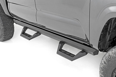 Give your lifted truck a stylish and functional upgrade with Rough Country's SRX2 Side Steps! Built with an innovative slotted aluminum rail system, these side steps offer unmatched versatility. Easily adjust the hoop steps by sliding the footpad left or right along the rail until itΓÇÖs perfectly positioned for easy entry and exit.Durable and Built to Last: Crafted from durable powder-coated aluminum, these steps are corrosion-resistant and designed to handle the harshest elements. The fabricated steel mounting brackets and black stainless steel zinc-plated hardware add strength and durability while ensuring a clean, sleek look. Molded end caps keep dirt and debris out, maintaining a polished appearance and long-lasting performance.Modern, Modular Design: The SRX2 Side Steps feature a modular construction, allowing you to configure and customize them to fit your style. Not only do they enhance functionality, but they also clean up your truckΓÇÖs profile by covering the unsightly body pinch-weld and frame.Easy Installation: Installing these adjustable side steps is quick and hassle-free. With an estimated 1-2 hour install time, youΓÇÖll be back on the road in no time. Simply bolt them on and adjust the step positioning to fit your needs.Warranty You Can Count On: Rough CountryΓÇÖs SRX2 Aluminum Steps come with a limited lifetime replacement warranty. Drive with confidence knowing your steps are protected against structural and workmanship defects for the life of the product.