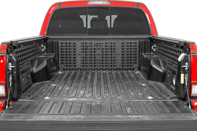 You shouldn't be penalized for being prepared to tackle the road less traveled. Efficiency is key when preparing for your next big adventure and we are pulling out all of the stops to ensure that your vehicle works for you.┬á At Rough Country we keep the adventurist in mind and have created a modern solution. Introducing Rough Country's Molle Rack System for Toyota Tacoma's!Whether your rig is a work horse or off-road overlander, this kit can be customized to get the job done. This modern solution easily secures to the side of the Tacoma's bed. Rough Country's Molle Rack system is constructed of heavy duty 1/8" thick steel and is coated with a durable powder coat finish!\
┬á\
Best of all, Rough CountryΓÇÖs Molle kit is a ready to install bolt on system with excellent fitment for your 05-21 Toyota Tacoma right out of the box. For added peace of mind, this Molle Rack System offers a retaining straps to ensure that your cargo is secured to your newest accessory.┬á\
┬á